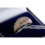 A 9CT YELLOW GOLD RING set with thirty diamonds, size R, approximately 3.2 grams.