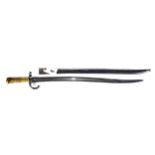 A 19TH CENTURY FRENCH BAYONET with ribbed brass hilt, hooked quillon, single edge fullered blade, 22