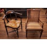 AN EDWARDIAN MAHOGANY MULTI LATH BACK ARMCHAIR, drop in seat raised on turned legs and an