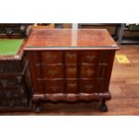 AN EARLY 20TH CENTURY SOUTH AFRICAN STINKWOOD CHEST OF DRAWERS fitted with three serpentine