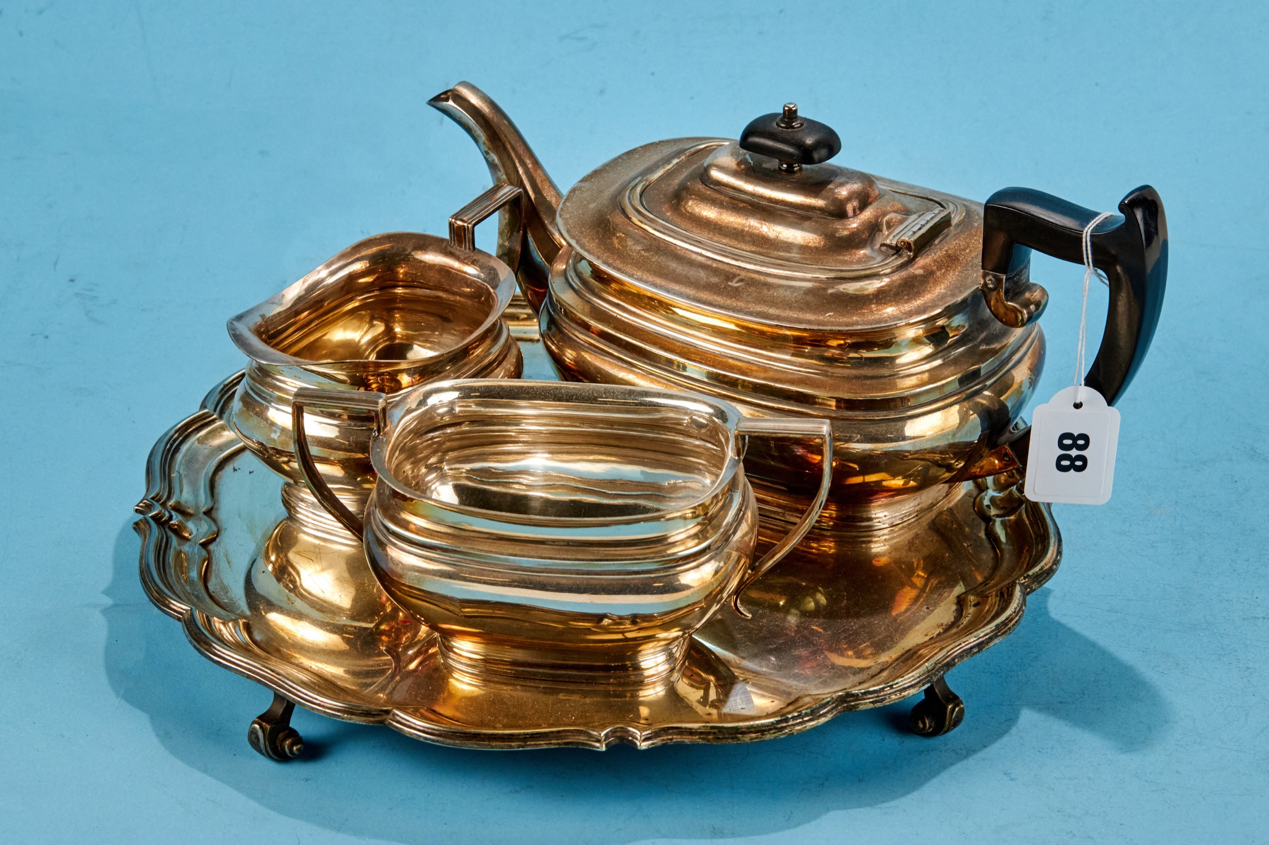 A 20TH CENTURY SILVER PLATED THREE PIECE TEA SET of compressed ovoid form, stamped Goldsmiths &