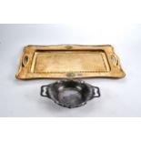 AN ARTS AND CRAFTS SPOT HAMMERED BRASS TEA TRAY with two inset abalone ovals, 14 ins x 23 ins and