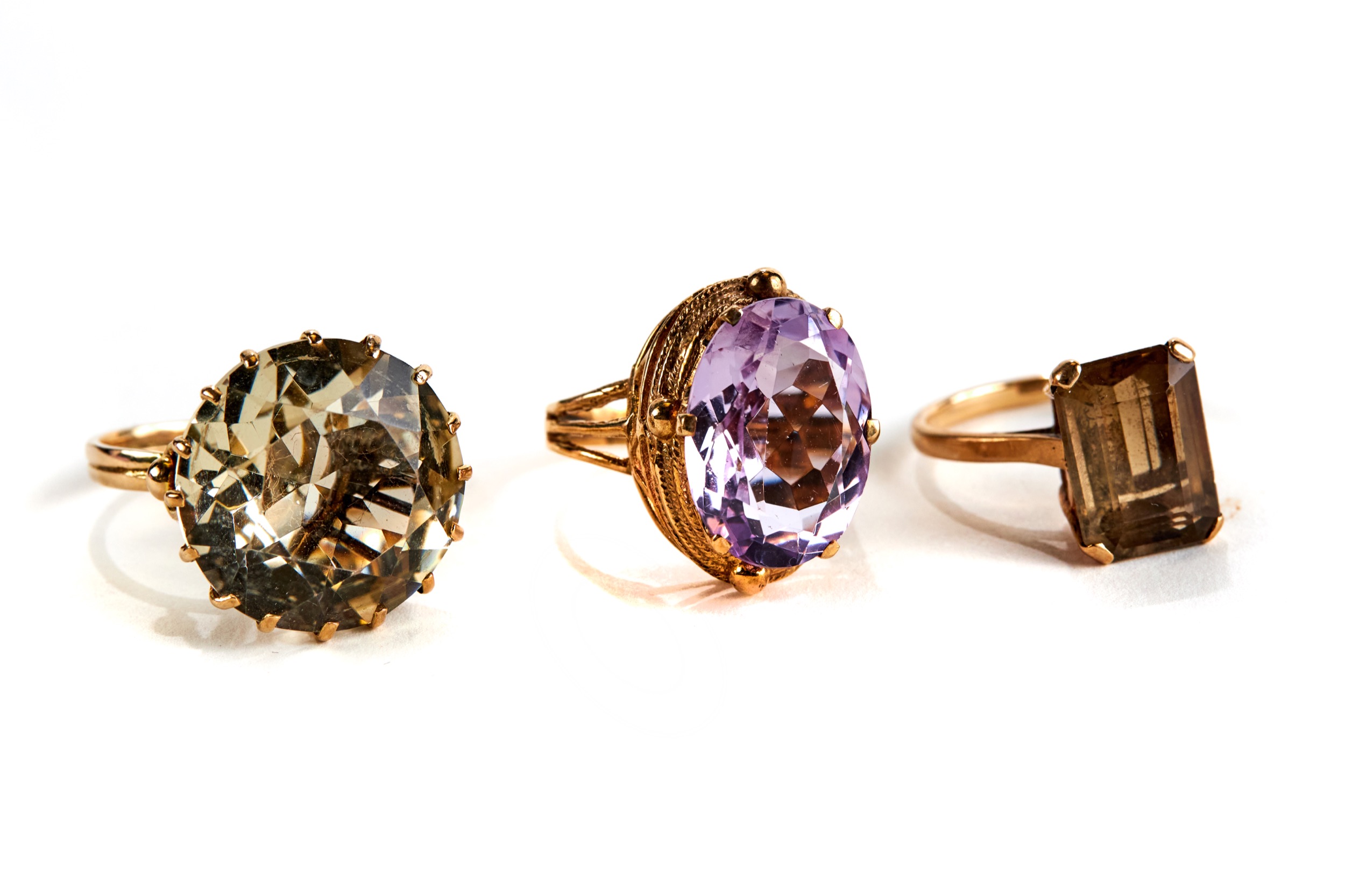 A 9CT GOLD AMETHYST SET DRESS RING and two 9ct gold stone set DITTOS, sizes O, P and R,