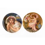 A PAIR OF LATE 19TH CENTURY CIRCULAR POTTERY WALL PLAQUES each hand painted with females, marked R.W