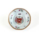 AN 18TH CENTURY CHINESE PORCELAIN DISH of octagonal outline decorated with a polychrome Armorial