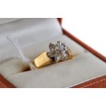 AN 18CT YELLOW GOLD DIAMOND FLOWER HEAD RING, size P, approximately 4.4 grams.