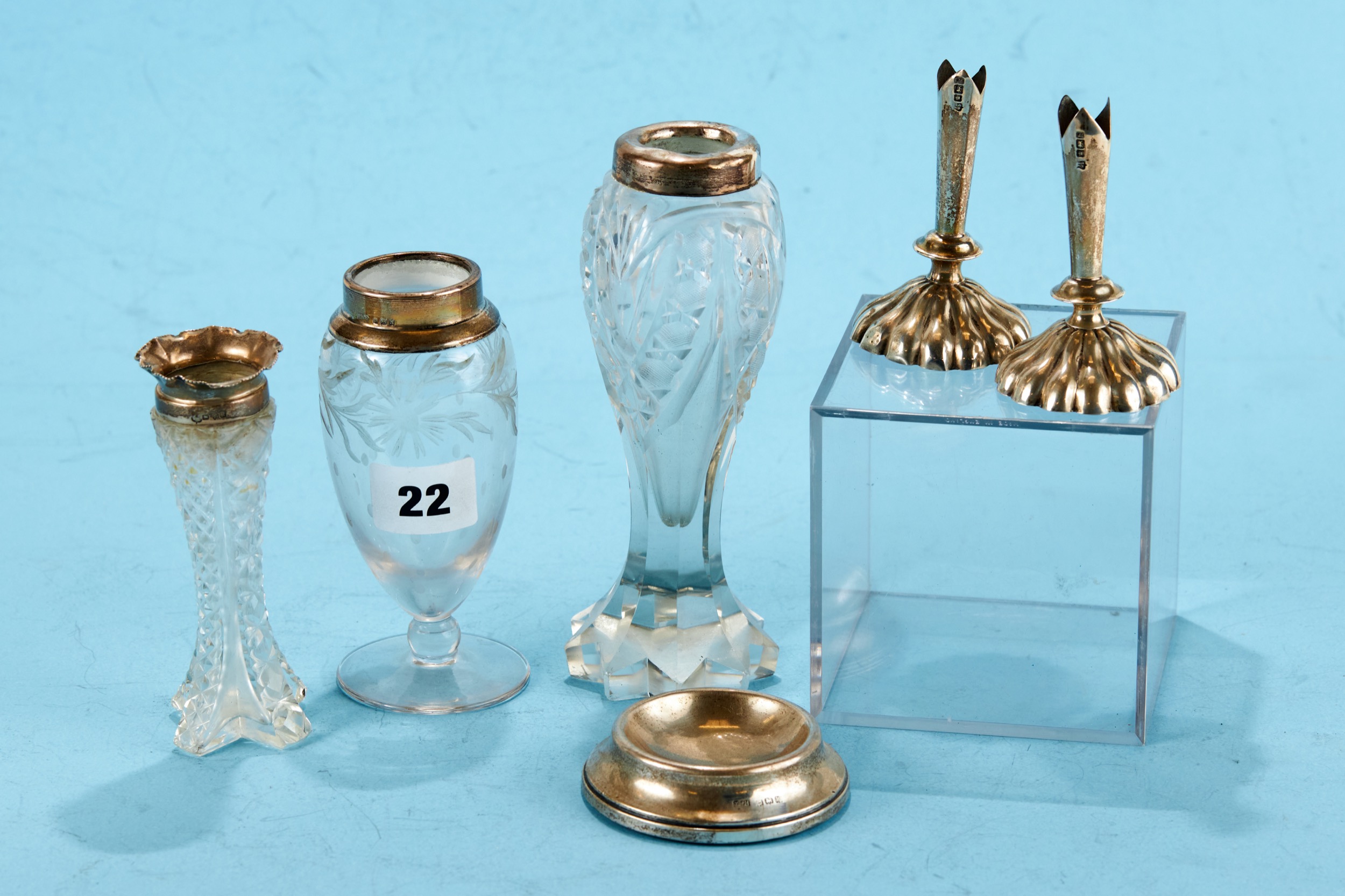 THREE CUT GLASS BUD VASES each with hallmarked silver collars, a circular silver PIN DISH,