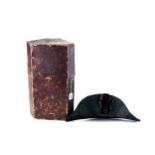 EDE AND RAVENSCROFT, LONDON, A NAVAL BLACK MOURNING HAT and leather covered storage case.