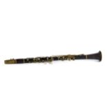 A LATE 19TH/EARLY 20TH CENTURY EBONISED WOOD CLARINET with nickel plated fittings, 25 ins long,