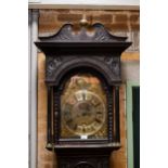 HENRICUS BAKER, APPLEBY, A LATE 18TH CENTURY CARVED OAK LONGCASE CLOCK, the arched brass dial with