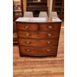 AN EARLY 19TH CENTURY MAHOGANY BOW FRONT CHEST OF DRAWERS, two short and three long graduated