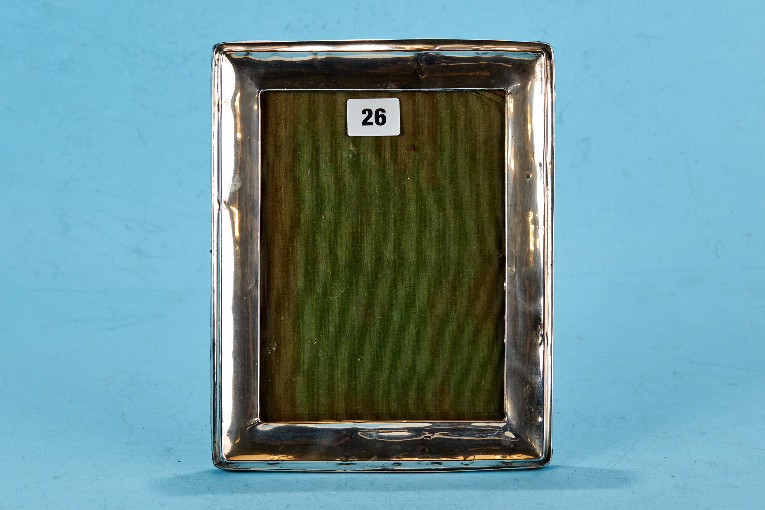 A GEORGE V RECTANGULAR SILVER PHOTOGRAPH FRAME of plain design, oak backed, Birmingham 1922,