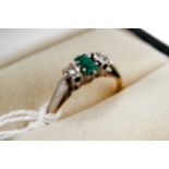 AN 18CT YELLOW GOLD AND PLATINUM THREE STONE EMERALD AND DIAMOND RING, maker: BKT, marks slightly