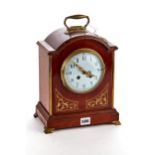 AN EDWARDIAN BRASS INLAID MAHOGANY REGENCY-REVIVAL BRACKET CLOCK, circular enamel dial with French