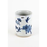 A CHINESE CYLINDRICAL PORCELAIN BRUSH POT decorated in underglaze blue with flowers and birds, 6 1/2