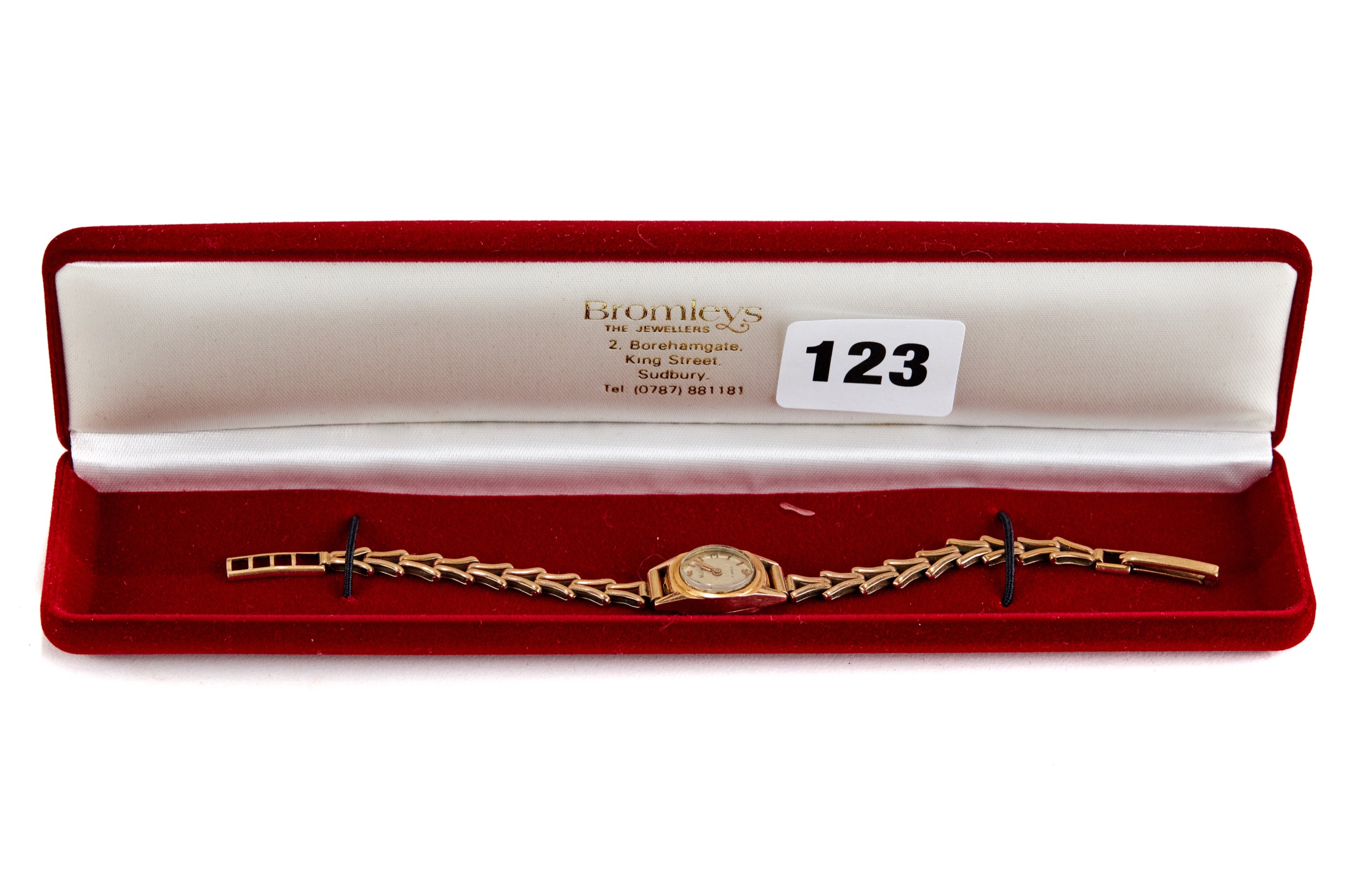 A LADY'S 18CT GOLD "MUDU" WRISTLET WATCH on a 9ct gold bracelet strap, 8.2 grams excluding movement.