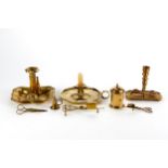 A 19TH CENTURY BRASS CHAMBER CANDLESTICK with side ejector on a shaped sided rectangular base, a
