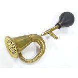An imitation brass car horn, 17'' long Please Note - we do not make reference to the condition of