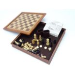 A games box with backgammon and chess boards, dice shakers, pieces etc. Please Note - we do not make