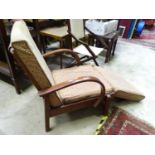 A vintage retro reclining armchair. Approx. 34" tall Please Note - we do not make reference to the