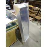 A rectangular modern mirror. Approx. 53" tall Please Note - we do not make reference to the