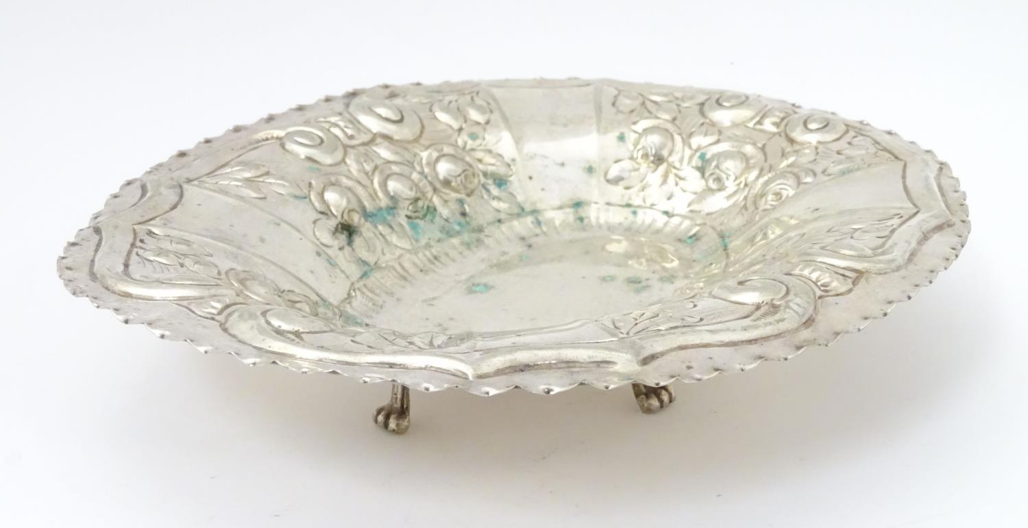 A silver plate dish of oval form with embossed decoration. Approx. 12" wide. Please Note - we do not - Image 3 of 5