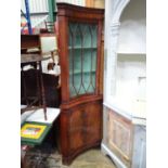 A late 20thC mahogany concave glazed top corner cabinet. Approx. 72" tall Please Note - we do not