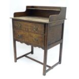 An early 20thC oak washstand with gallery and two drawers. Approx. 32" high Please Note - we do