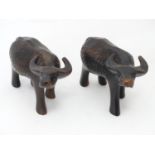 A pair of carved wooden buffalo / ox Please Note - we do not make reference to the condition of lots