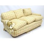 A large three seat sofa with horse hair upholstery and feather cushions. 72'' long x 40'' wide x