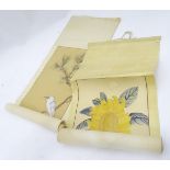 Two oriental hand painted scrolls one depicting a sunflower, one depicting a white, long tailed bird