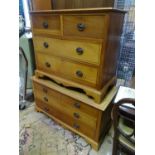 A two over two pine chest of drawers, together with matching low two over two chest of drawers.