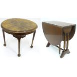 Two walnut and mahogany occasional tables. The largest approx. 24" in diameter (2) Please Note -