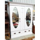 An early 20thC white painted armoire. Approx. 80" tall Please Note - we do not make reference to the
