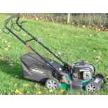 A Qualcast self drive lawn mower with petrol can and instructions Please Note - we do not make