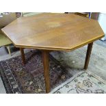 An oak octagonal dining table. Approx. 46" wide Please Note - we do not make reference to the