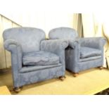 A pair of blue upholstered armchairs Please Note - we do not make reference to the condition of lots