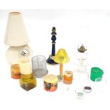 A quantity of candles and candle holders, to include a Whitefriars coloured bark glass candle