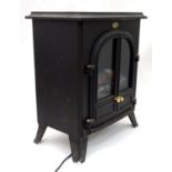 A Dimplex electric fire. Approx. 26" tall Please Note - we do not make reference to the condition of