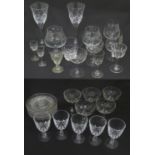 A quantity of assorted drinking glasses to include brandy tumblers / glasses, crystal wine