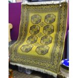 A 20thC rug with an ochre ground. Approx. 70" long Please Note - we do not make reference to the