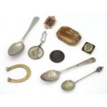 A quantity of assorted items to include a silver spoon, pin badges, etc. Please Note - we do not