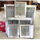 A quantity of late 19th / early 20thC stained glass within wooden surrounds. The largest approx. 44"