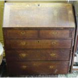 A Georgian oak bureau. Approx. 40" tall Please Note - we do not make reference to the condition of
