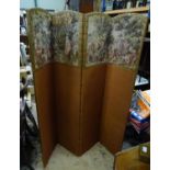 A four fold 20thC dressing screen / room divider with tapestry decoration. Approx. 65 3/4" tall