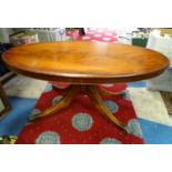 A 20thC mahogany oval occasional table. Approx. 48" wide Please Note - we do not make reference to