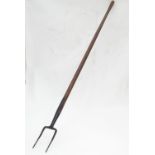 A hay fork. Approx. 62" long Please Note - we do not make reference to the condition of lots