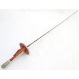 A Leon Paul fencing foil with a leather bound handle. Blade approx. 35" long Please Note - we do not