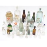 A quantity of chemist bottles and beer bottles. Largest approx. 14" tall Please Note - we do not