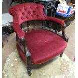 An upholstered armchair with carved supports. Approx. 29" tall Please Note - we do not make